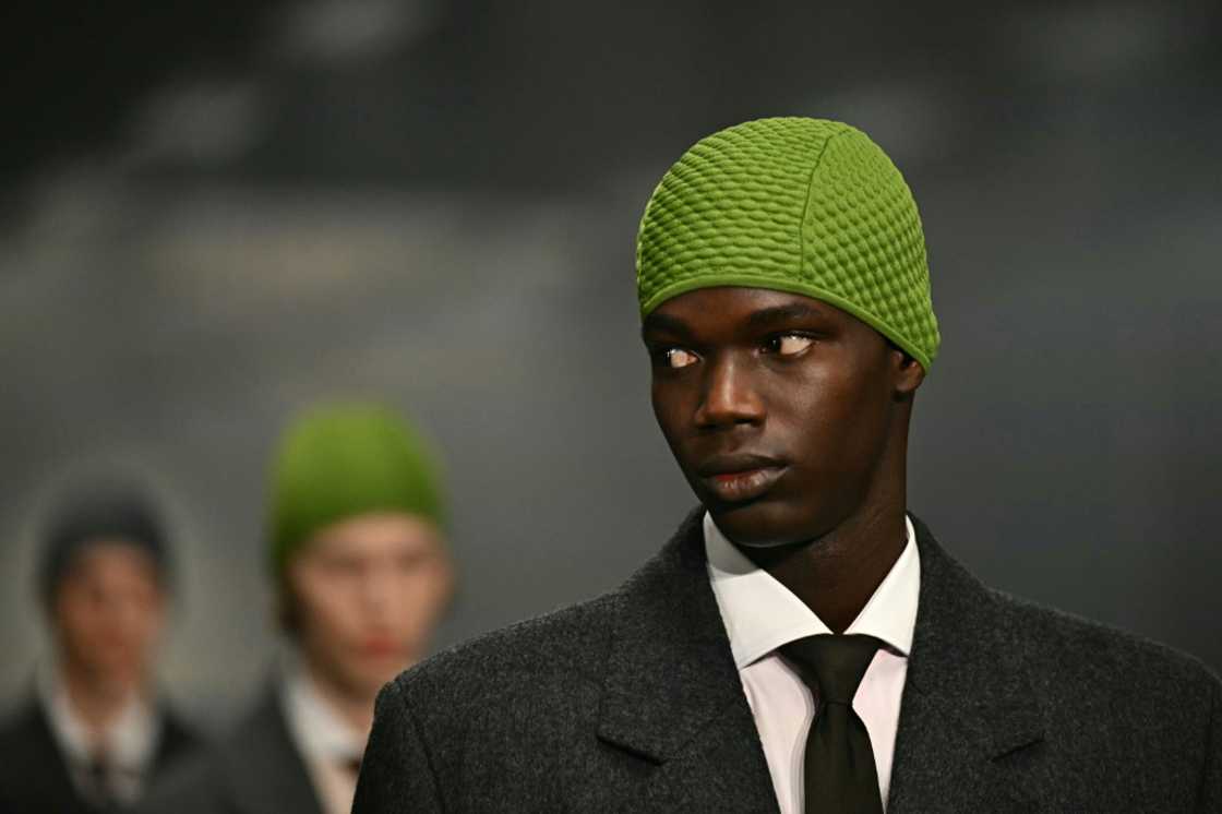 Prada brightened up dour work suits with beany hats in purple, bright red and apple green Prada brightened up dour work suits with beany hats in purple, bright red and apple green