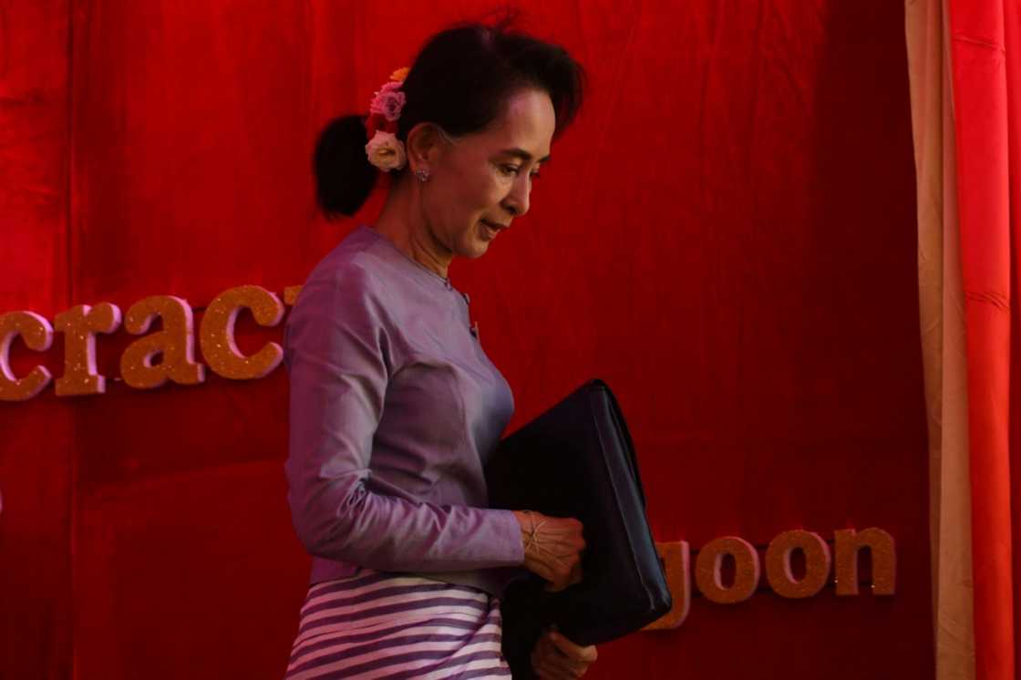 Suu Kyi, 77, has been kept virtually incommunicado by the military and was recently transferred from house arrest to solitary confinement while she faces multiple trials Suu Kyi, 77, has been kept virtually incommunicado by the military and was recently transferred from house arrest to solitary confinement while she faces multiple trials