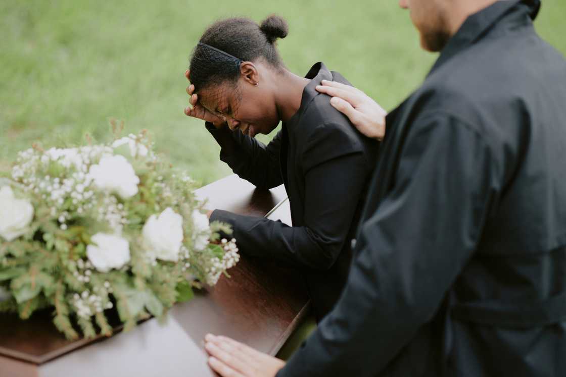 A womna during a funeral A womna during a funeral