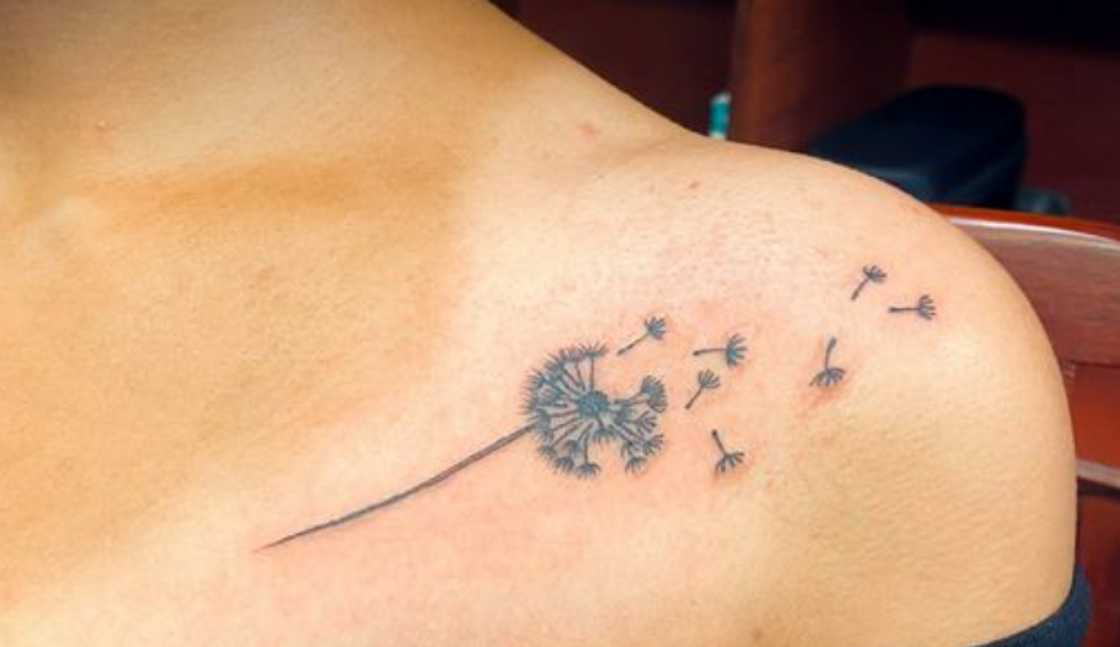 Dandelion flower collarbone tattoo