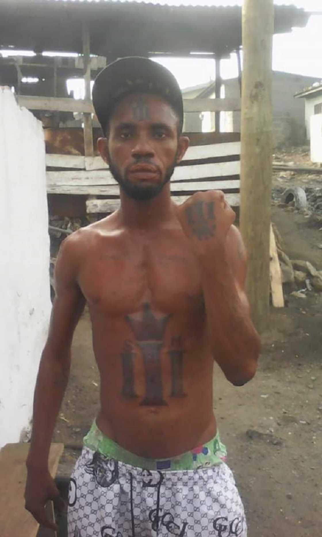 Loyal SM fan tattoos Shatta Wale's 'Reign' symbol all over his stomach and forehead Loyal SM fan tattoos Shatta Wale's 'Reign' symbol all over his stomach and forehead