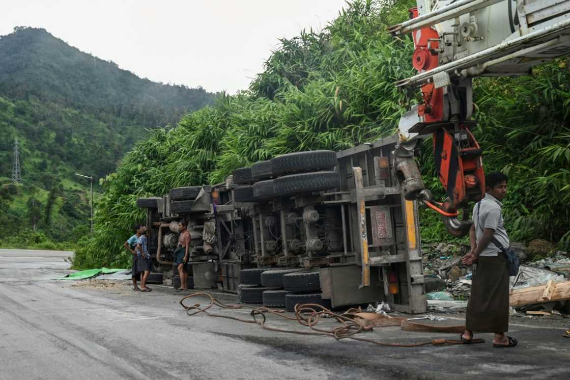 Monsoon-soaked hills periodically shed rocks and earth onto the road, burying parts of the route for days Monsoon-soaked hills periodically shed rocks and earth onto the road, burying parts of the route for days