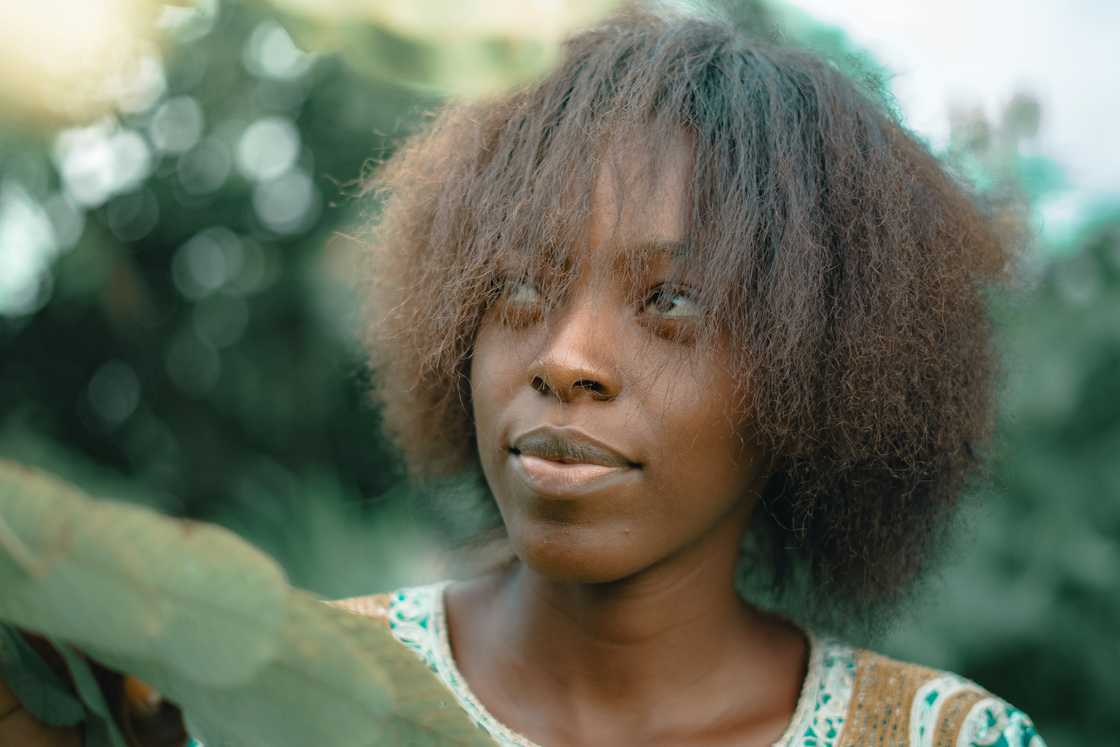 a woman gazing dreamily a woman gazing dreamily