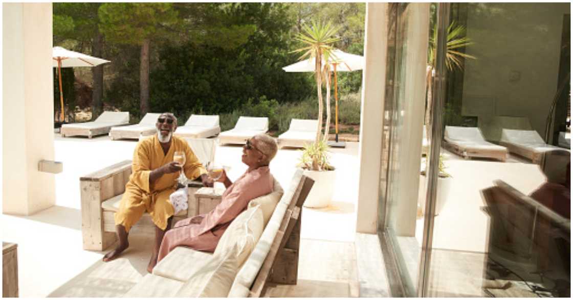 A couple enjoying their stay in a luxury home A couple enjoying their stay in a luxury home