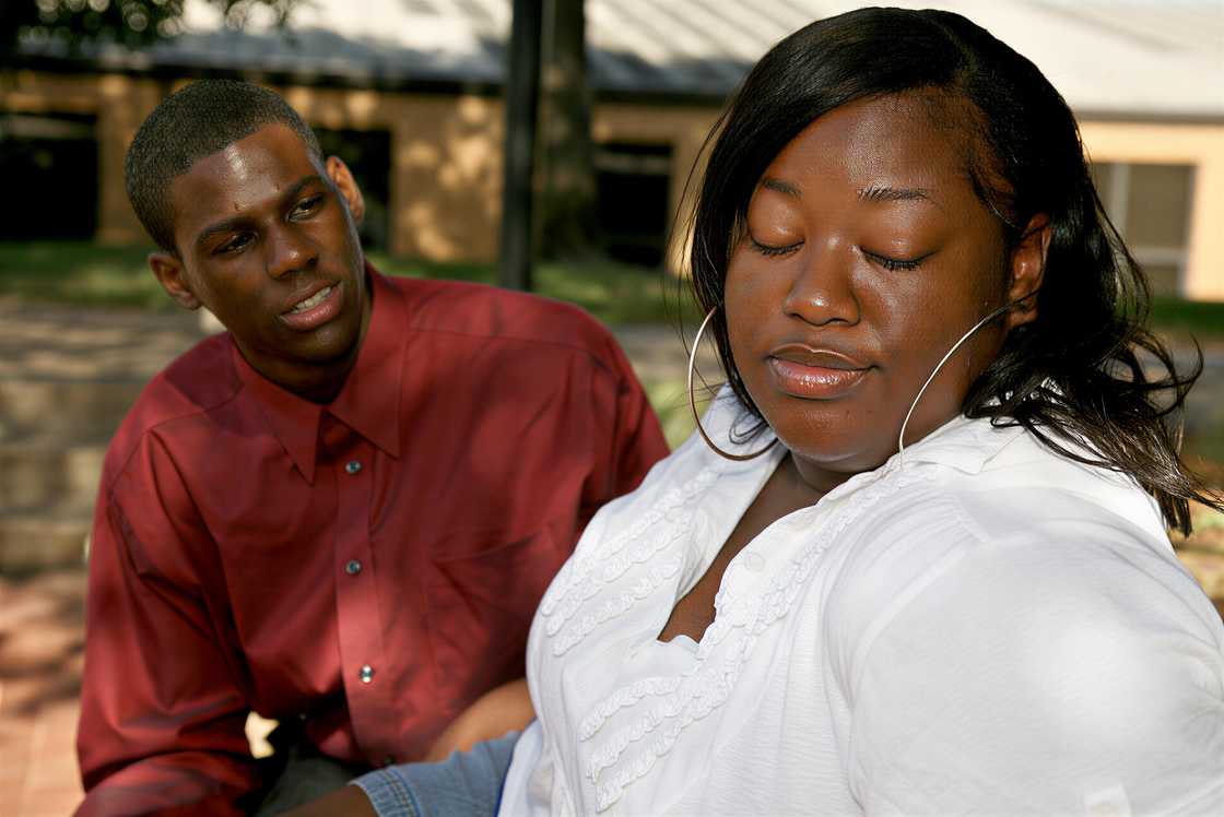 A man begging for forgiveness in an argument