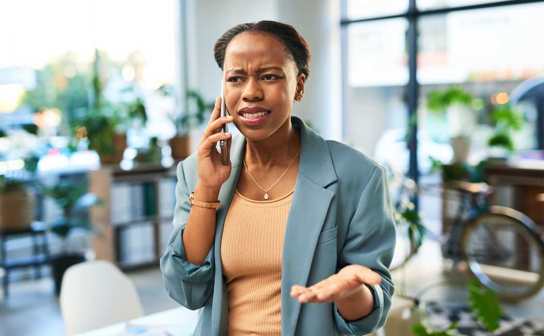 A dissapointed young woman on a call