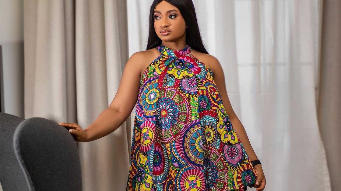 A woman with a flared cold shoulder top A woman with a flared cold shoulder top