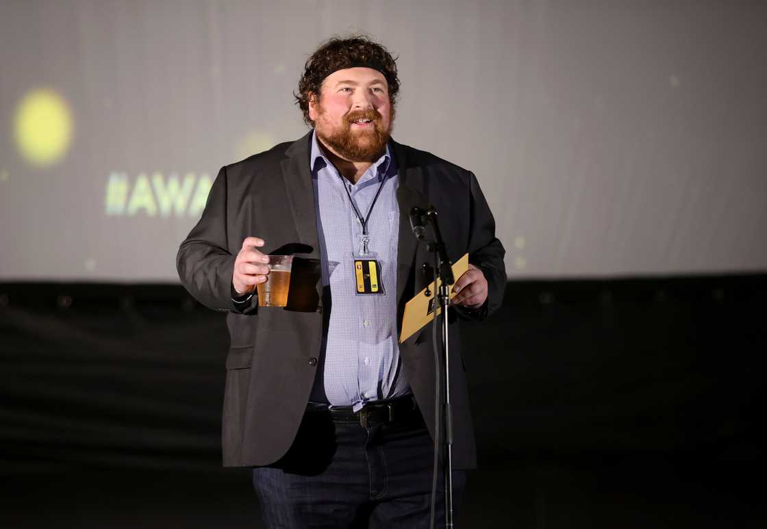 Tommy Bechtold speaks onstage during the Film Threat 2021 Award This! Awards Drive-In Ceremony Tommy Bechtold speaks onstage during the Film Threat 2021 Award This! Awards Drive-In Ceremony