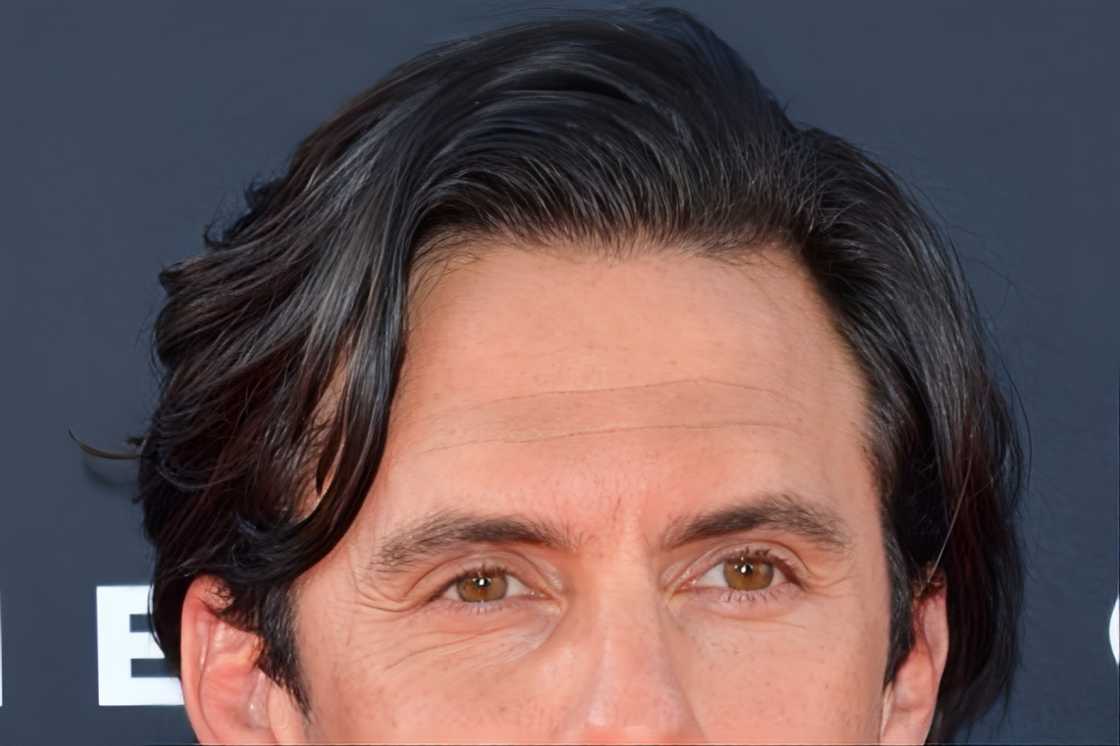 A man rocks an asymmetrical side-swept hair A man rocks an asymmetrical side-swept hair