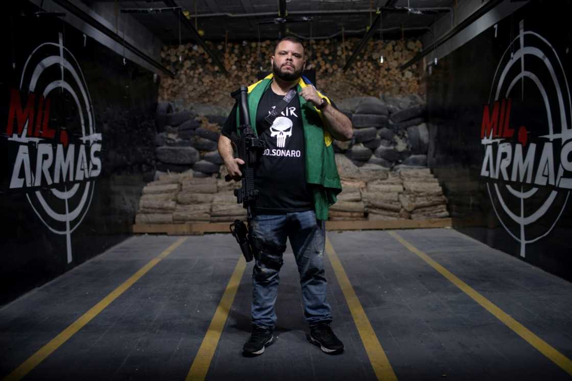 Ex-policeman Elitusalem Gomes Freitas is part of a booming demographic in President Jair Bolsonaro's Brazil: gun ownership has more than quintupled since the far-right president took office in 2019. Ex-policeman Elitusalem Gomes Freitas is part of a booming demographic in President Jair Bolsonaro's Brazil: gun ownership has more than quintupled since the far-right president took office in 2019.