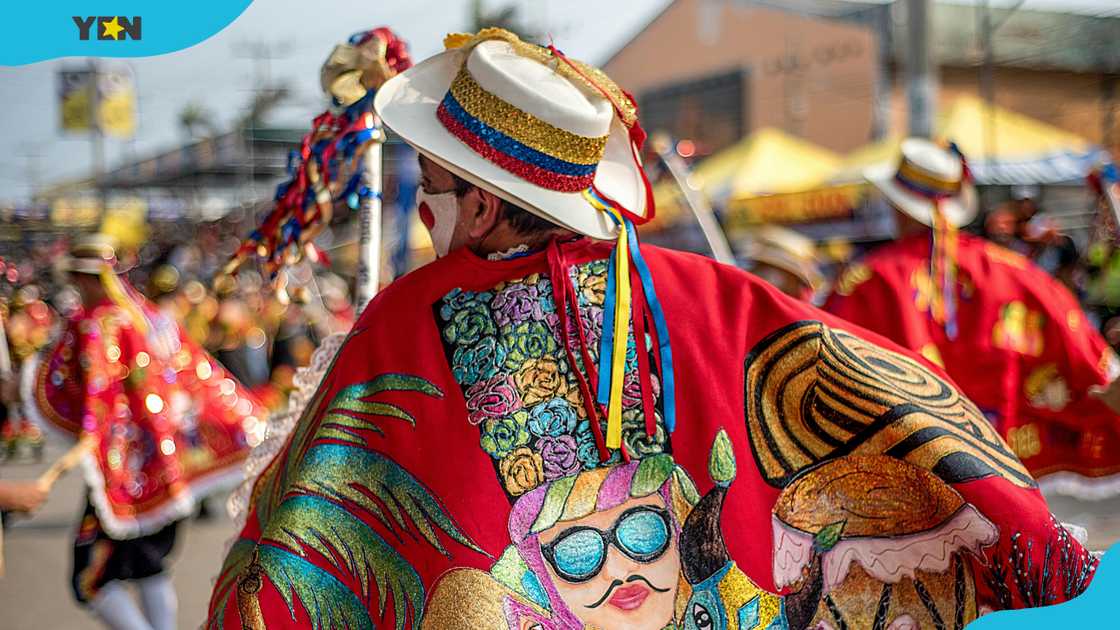 Dancers in colourful clothes dancing on a parade during a festival in Colombia Dancers in colourful clothes dancing on a parade during a festival in Colombia