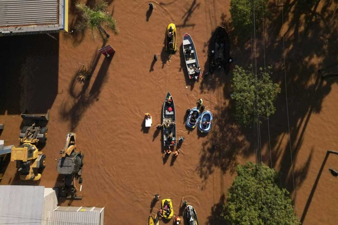 Historic levels of rainfall and flooding in southern Brazil, such as seen in this aerial view over Porto Alegre on May 6, 2024, have fueled a spate of conspiracy theories