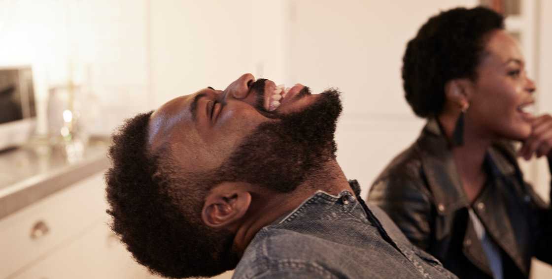 Man laughing at girlfriend Man laughing at girlfriend