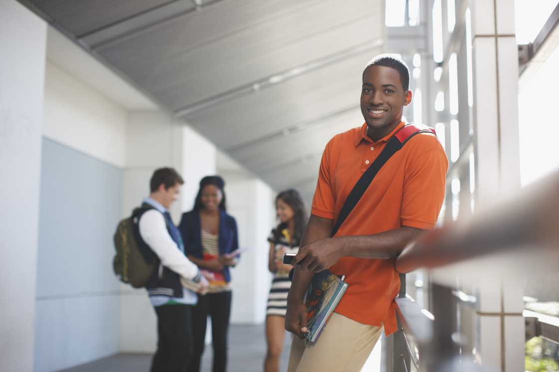 Student smiling in hallway