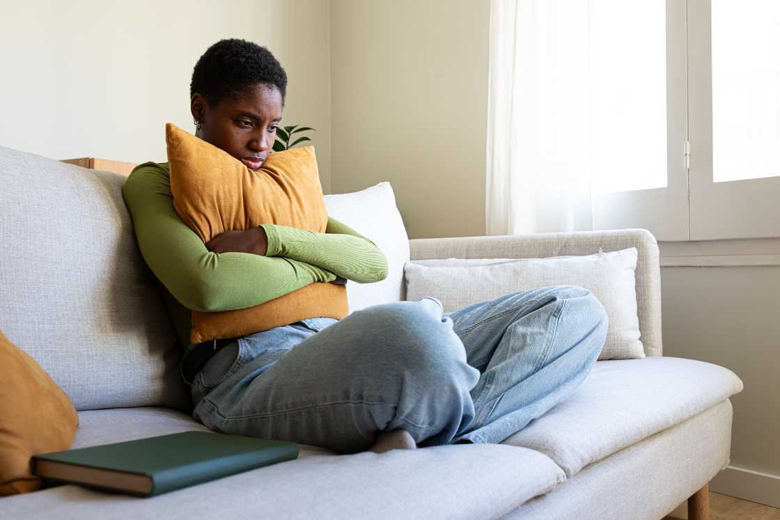 A young black woman is feeling depressed