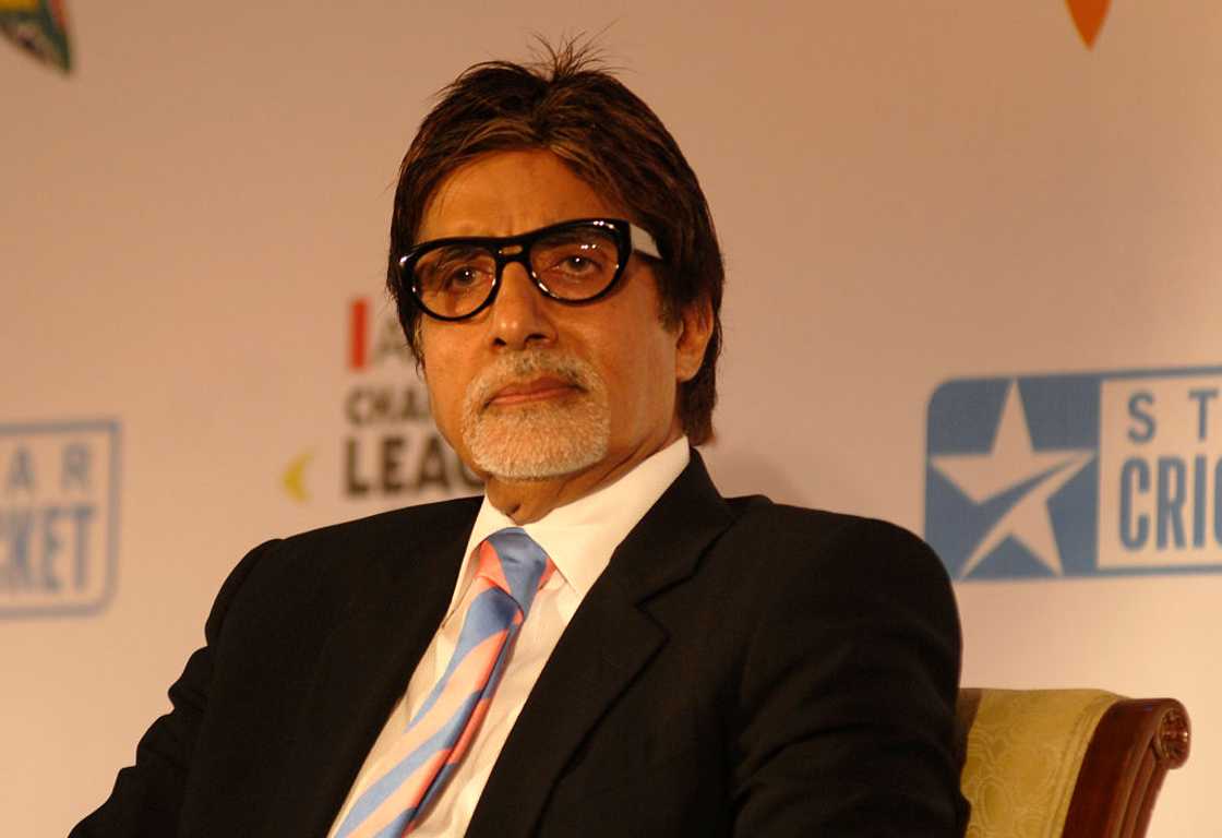 Amitabh Bachchan in a black coat and glasses