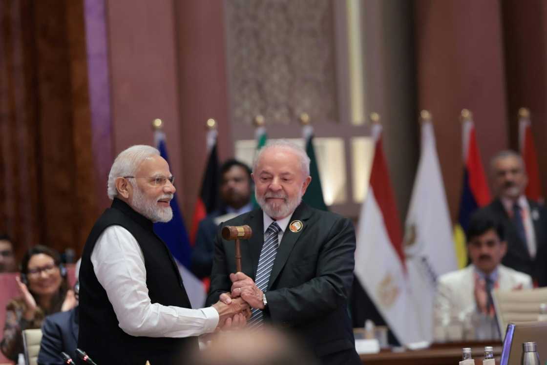 India's Prime Minister Narendra Modi (L) hands over the gavel to Brazil's President Luiz Inacio Lula da Silva (R) and the end of the G20 summit India's Prime Minister Narendra Modi (L) hands over the gavel to Brazil's President Luiz Inacio Lula da Silva (R) and the end of the G20 summit