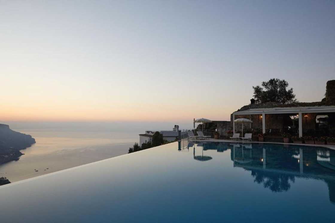 A view of the Belmond Hotel Italy at dusk A view of the Belmond Hotel Italy at dusk