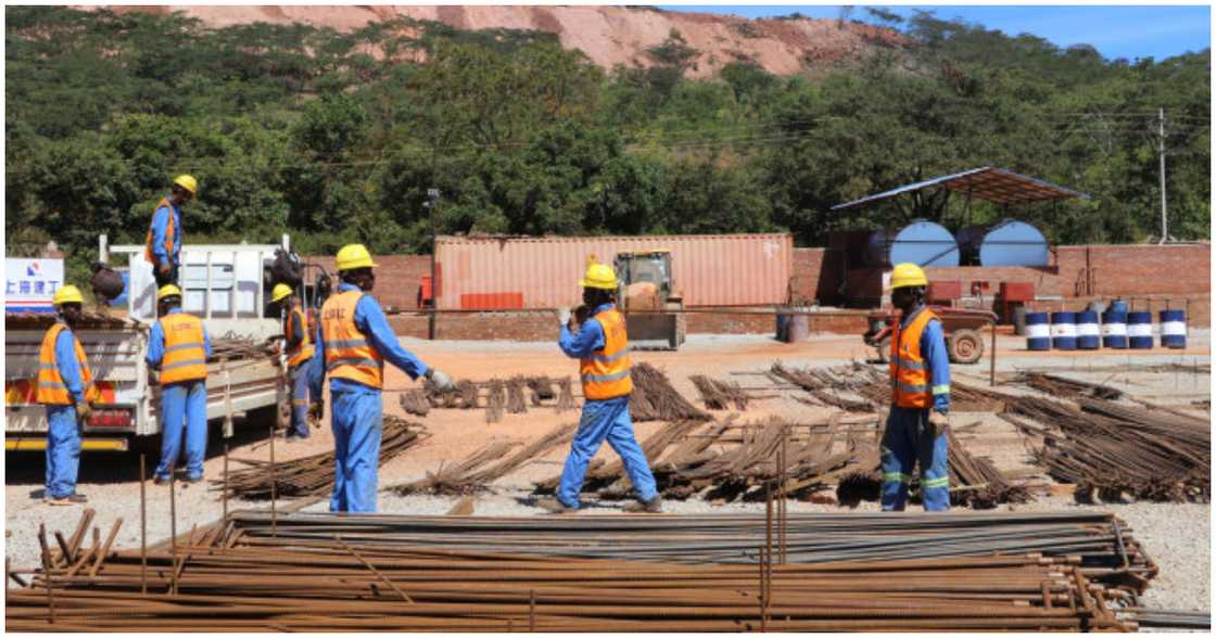 Workers at the Zimbabwe parliament building in 2018 Workers at the Zimbabwe parliament building in 2018