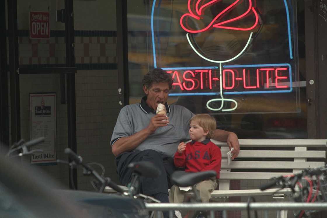 Maury enjoys an icecream with his adopted son Maury enjoys an icecream with his adopted son