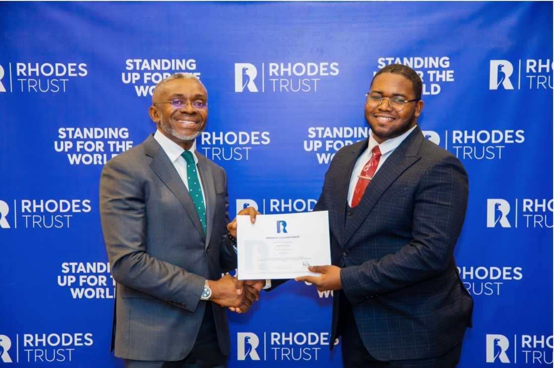 Sylvester Benson receives his Rhodes Scholarship finalist certificate.
