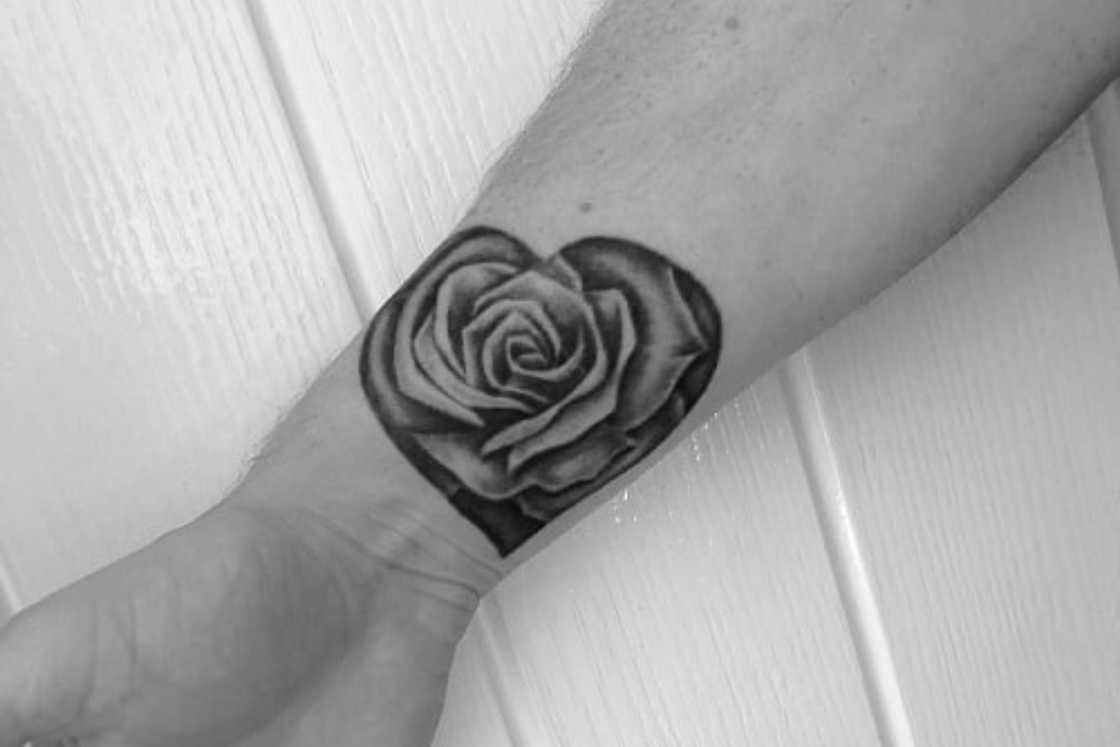 A black and grey rose wrist tattoo A black and grey rose wrist tattoo