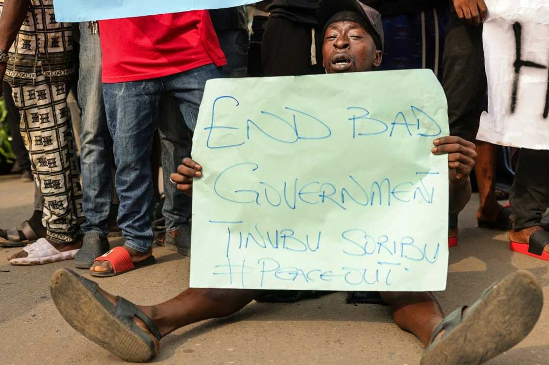 Demonstrators in the southern city of Ibadan carried signs saying 'End bad government', 'End food scarcity' and 'End Nigerian hardship' Demonstrators in the southern city of Ibadan carried signs saying 'End bad government', 'End food scarcity' and 'End Nigerian hardship'