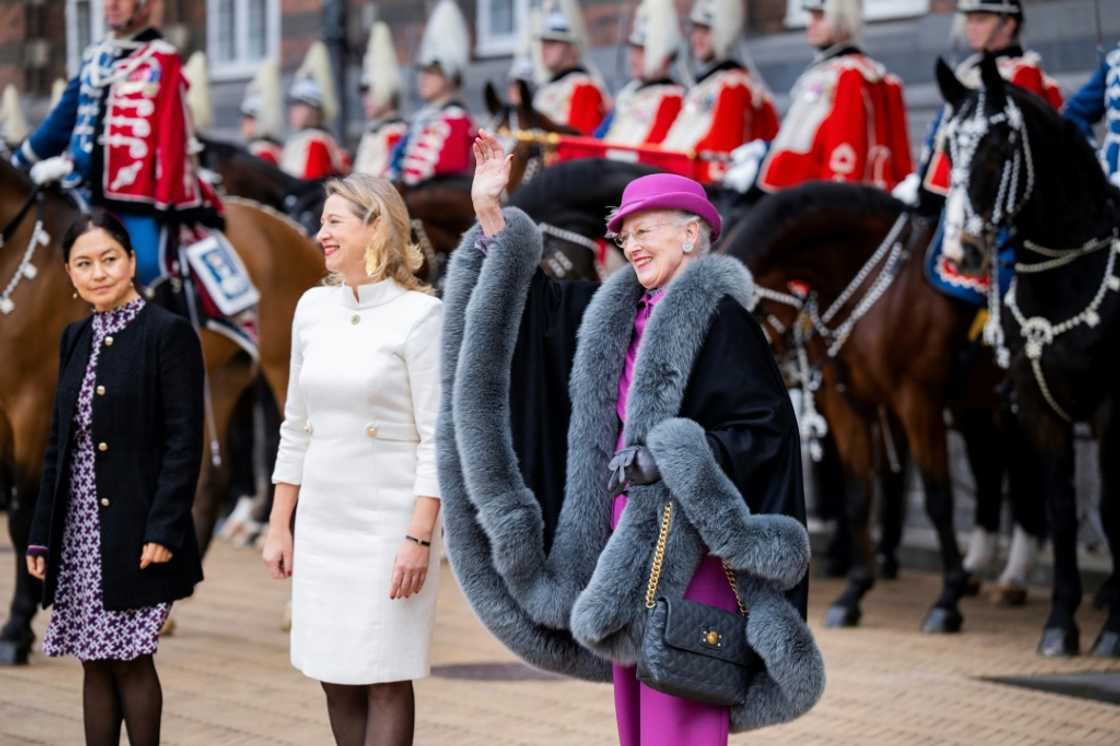 Queen Margrethe II waves to onlookers as she is welcomed by Copenhagen's Mayor Sophie Haestorp Andersen at city hall Queen Margrethe II waves to onlookers as she is welcomed by Copenhagen's Mayor Sophie Haestorp Andersen at city hall
