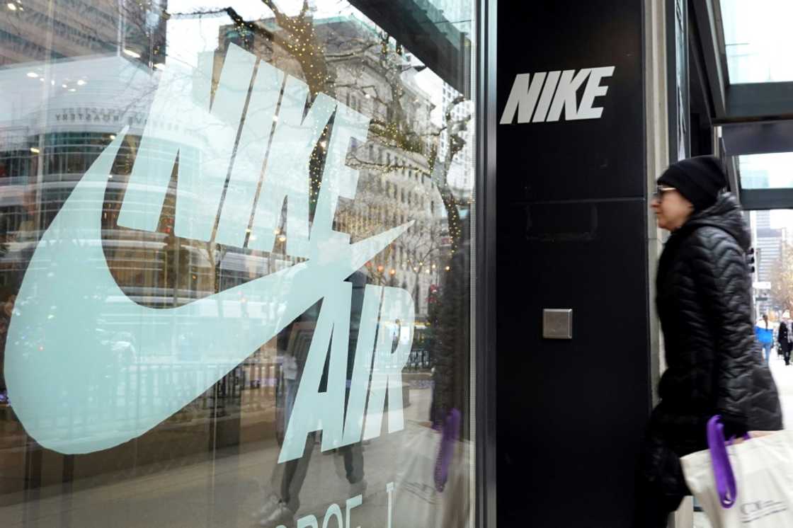 Nike shares fell after the sports giant reported lower profits Nike shares fell after the sports giant reported lower profits