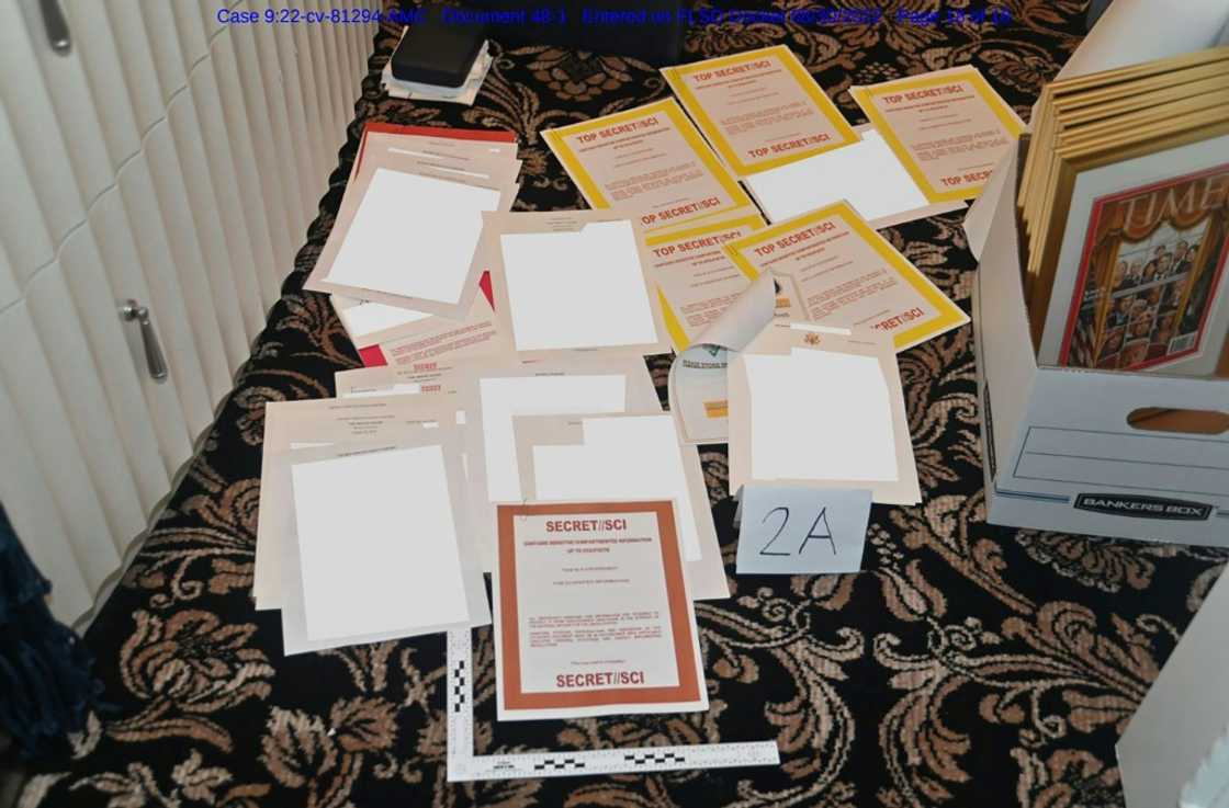 This undated file photo released by the US Department of Justice on August 31, 2022 shows a photo of documents allegedly seized at Donald Trump's Mar-a-Lago resort spread over a carpet This undated file photo released by the US Department of Justice on August 31, 2022 shows a photo of documents allegedly seized at Donald Trump's Mar-a-Lago resort spread over a carpet