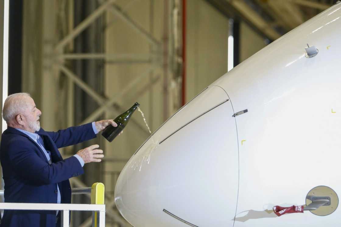 Brazilian President Luiz Inacio Lula da Silva christens the Embraer E2-190 aircraft in April 2024