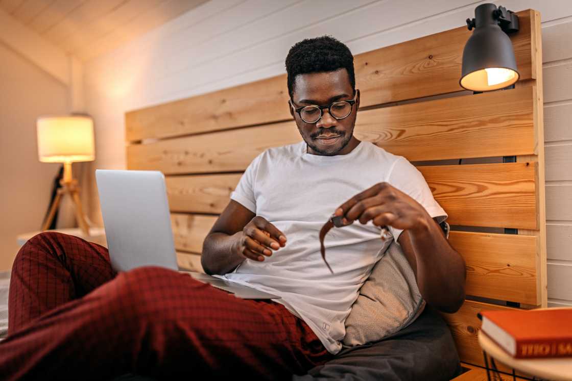 A young man wearing eyeglasses