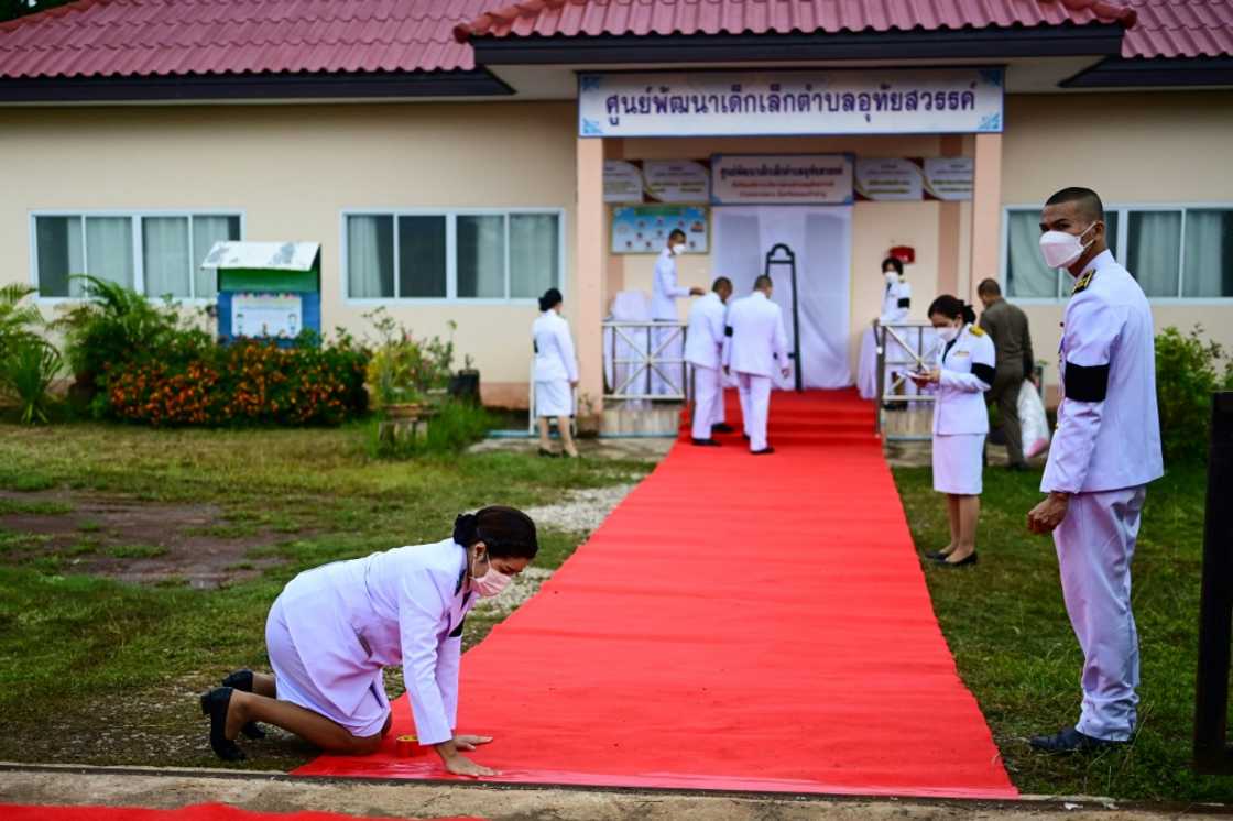 Officials prepare a red carpet in Nong Bua Lam Phu province ahead of the arrival of Thailand's King Maha Vajiralongkorn Officials prepare a red carpet in Nong Bua Lam Phu province ahead of the arrival of Thailand's King Maha Vajiralongkorn