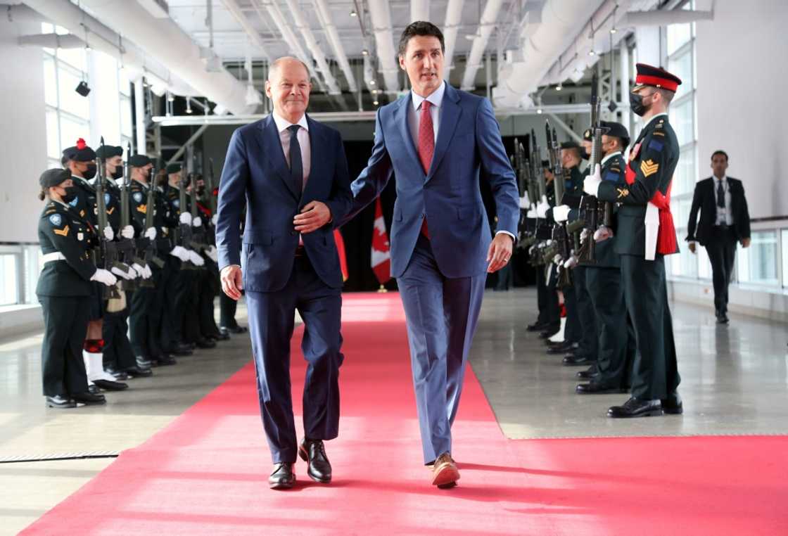 Canada's Prime Minister Justin Trudeau (R) welcomes visiting German Chancellor Olaf Scholz before their meeting at the Montreal Science Centre to discuss energy trade Canada's Prime Minister Justin Trudeau (R) welcomes visiting German Chancellor Olaf Scholz before their meeting at the Montreal Science Centre to discuss energy trade