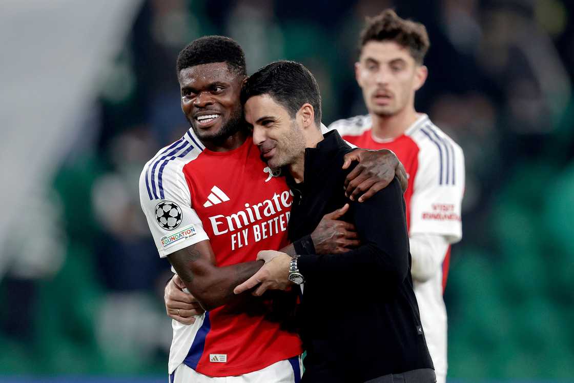 Thomas Partey of Arsenal, coach Mikel Arteta of Arsenal celebrating the victory during the UEFA Champions League match between Sporting CP v Arsenal at the Estadio Jose Alvalade on November 26, 2024 in Lisbon Portugal Thomas Partey of Arsenal, coach Mikel Arteta of Arsenal celebrating the victory during the UEFA Champions League match between Sporting CP v Arsenal at the Estadio Jose Alvalade on November 26, 2024 in Lisbon Portugal