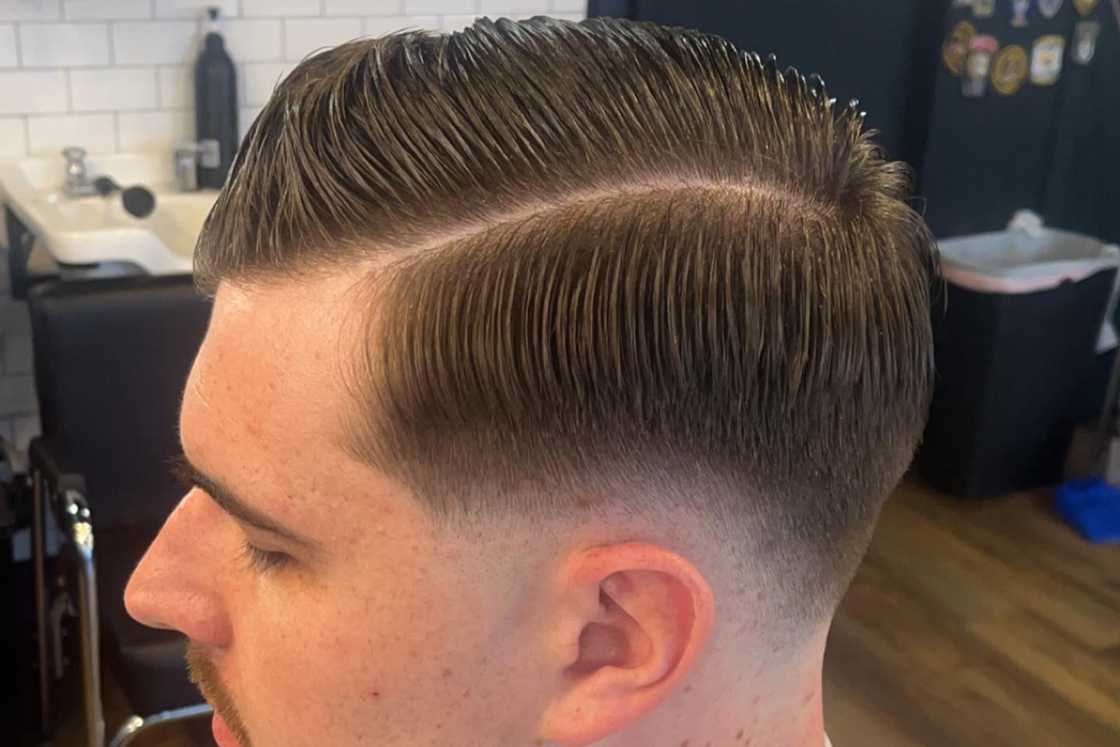 A man with a hard part hairstyle A man with a hard part hairstyle