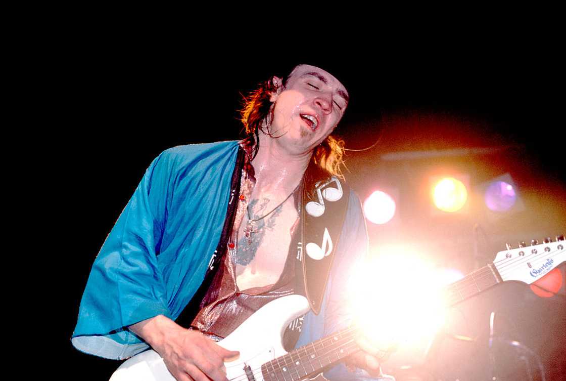 American musician Stevie Ray Vaughan plays guitar as he performs onstage at the Fireside Bowl, Chicago, Illinois. American musician Stevie Ray Vaughan plays guitar as he performs onstage at the Fireside Bowl, Chicago, Illinois.