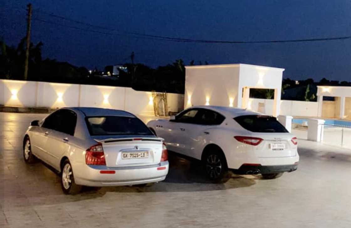 Cars parked in the compound of mansion, posted by Henry Fitz.