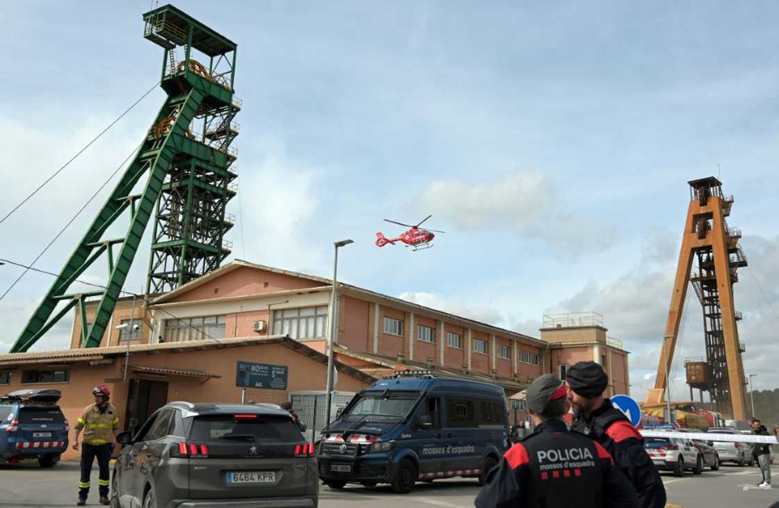 The three miners were trapped at a depth of 900 metres (2,950 feet) after the collapse of a gallery at a potash mine near Barcelona, rescuers said The three miners were trapped at a depth of 900 metres (2,950 feet) after the collapse of a gallery at a potash mine near Barcelona, rescuers said