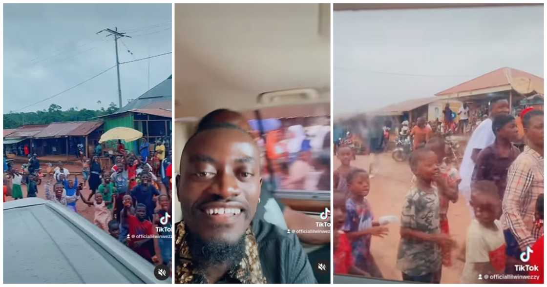 Children chase Lil Win's car excitedly as he drives through their town