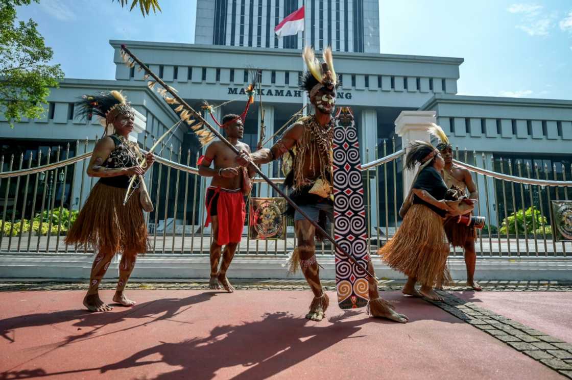 Representatives of the Awyu and Moi Indigenous tribes protest in front of Indonesia's Supreme Court Representatives of the Awyu and Moi Indigenous tribes protest in front of Indonesia's Supreme Court