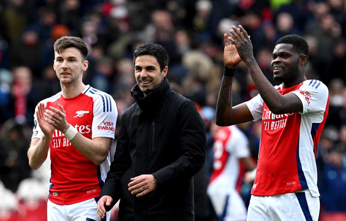 Mikel Arteta, Manager of Arsenal, smiles as Kieran Tierney and Thomas Partey of Arsenal applaud the fans after the team's EPL victory against Chelsea on March 16, 2025 in London, England Mikel Arteta, Manager of Arsenal, smiles as Kieran Tierney and Thomas Partey of Arsenal applaud the fans after the team's EPL victory against Chelsea on March 16, 2025 in London, England
