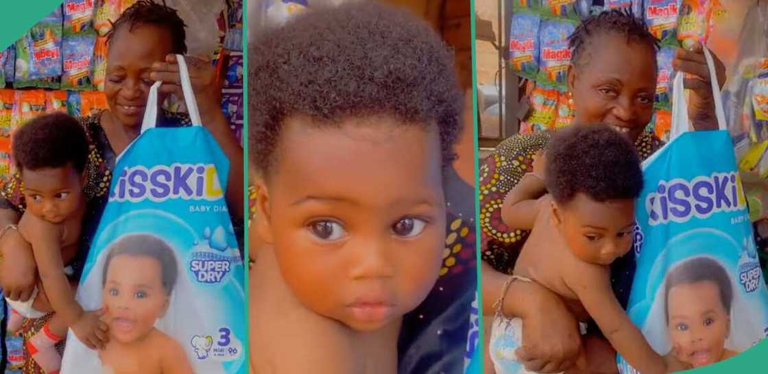 Mother shows off her baby beside Kisskids diaper pack Mother shows off her baby beside Kisskids diaper pack