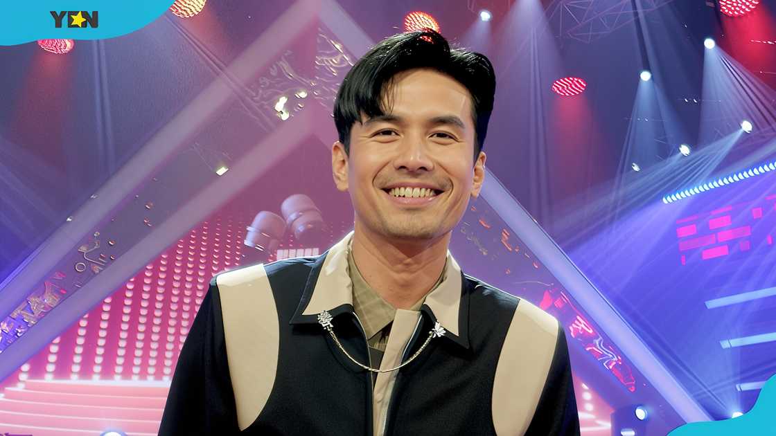 Christian Bautista poses against a stage setting Christian Bautista poses against a stage setting