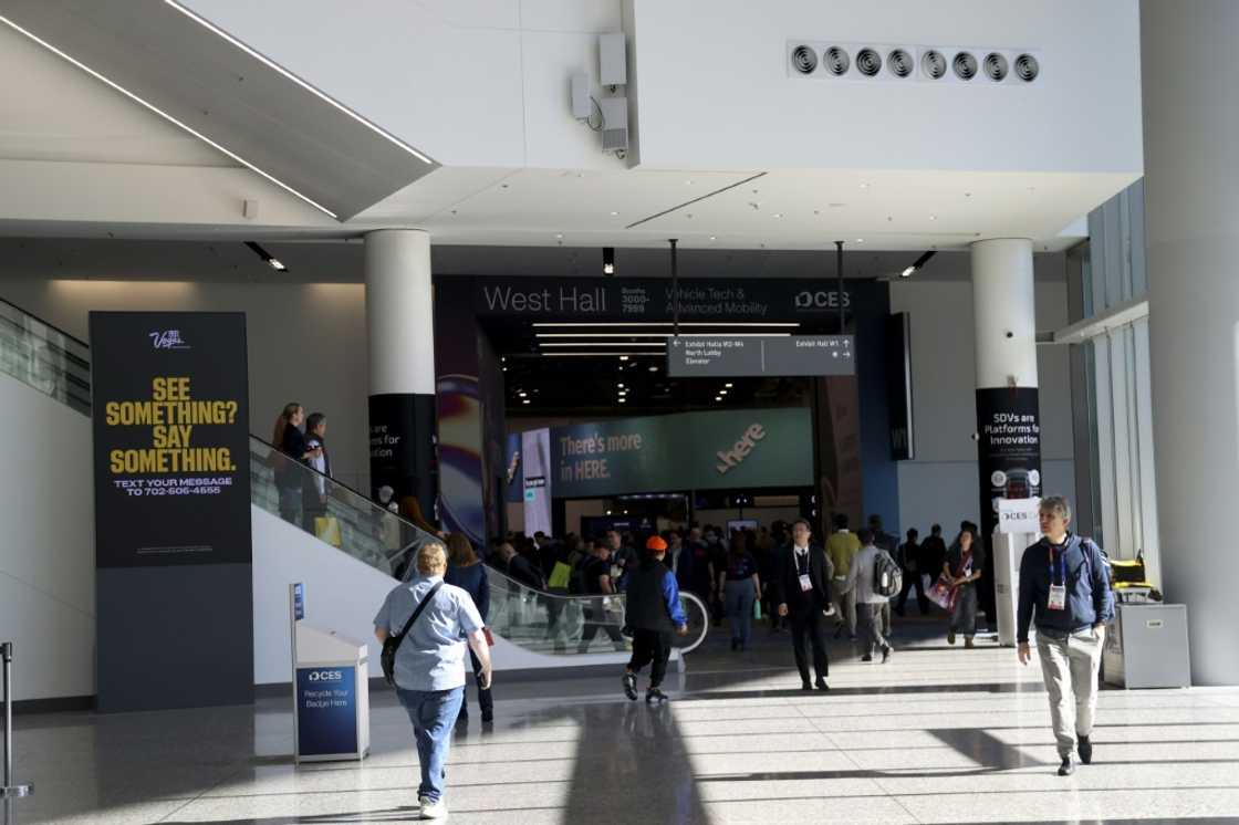 Attendees walk through the main entrance during the Consumer Electronics Show in Las Vegas on January 10, 2025