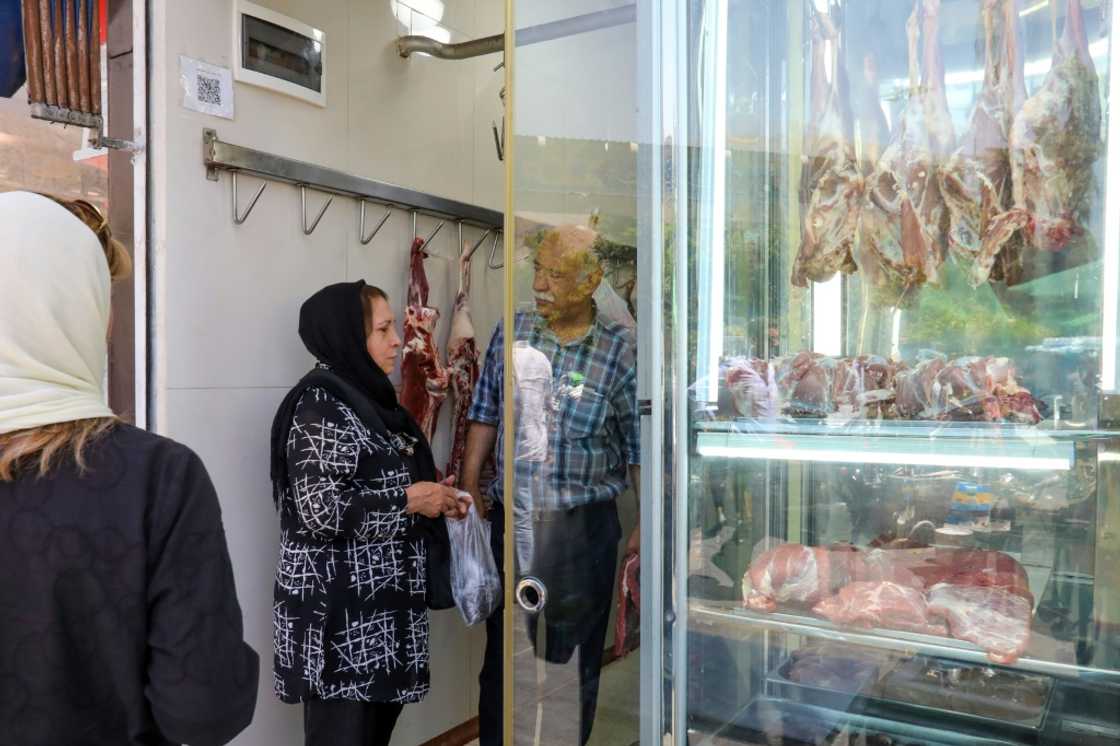 A woman shops at a butcher's in Tehran. Iran has been wrestling with rampant price growth for years, exceeding 30 percent annually every year since 2018, according to the International Monetary Fund A woman shops at a butcher's in Tehran. Iran has been wrestling with rampant price growth for years, exceeding 30 percent annually every year since 2018, according to the International Monetary Fund