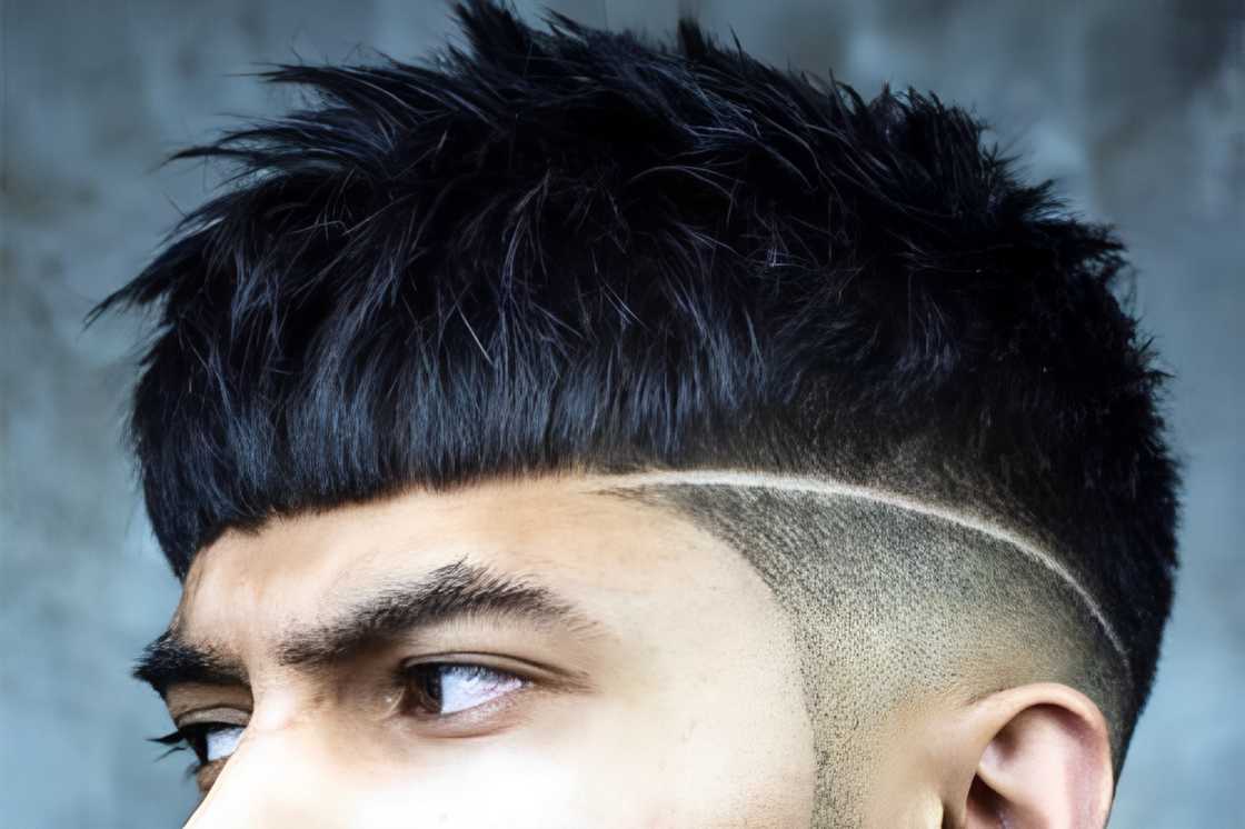 A man with black with a textured crop haircut A man with black with a textured crop haircut