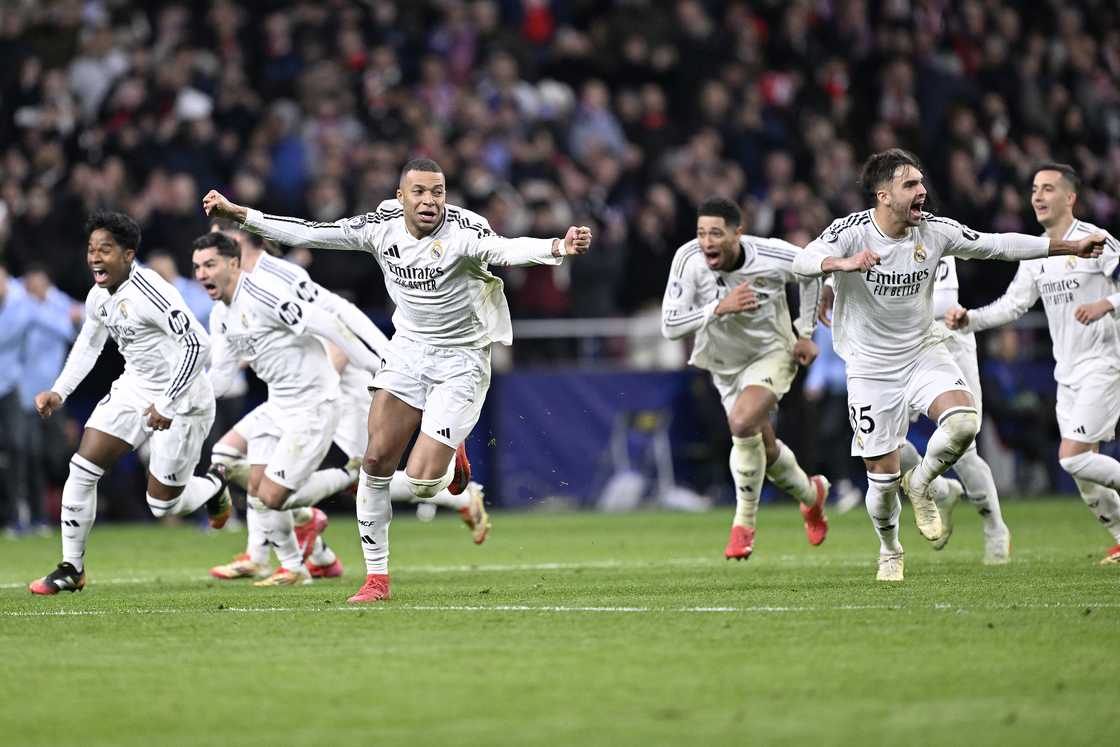 Real Madrid players celebrate after knocking out Atletico Madrid 4-2 on penalties on March 12, 2025 to reach the 2024/25 UEFA Champions League quarter-finals Real Madrid players celebrate after knocking out Atletico Madrid 4-2 on penalties on March 12, 2025 to reach the 2024/25 UEFA Champions League quarter-finals