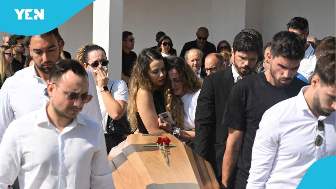 Diogo Jota’s wife, Jota's widow, Rute Cardoso, Rute Cardoso hugs friend, marathon runner, runner honours Diogo Jota, Liverpool, Anfield. Diogo Jota’s wife, Jota's widow, Rute Cardoso, Rute Cardoso hugs friend, marathon runner, runner honours Diogo Jota, Liverpool, Anfield.