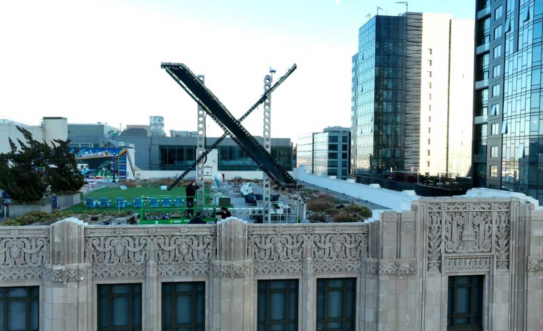Workers install a large X on the roof of the former Twitter headquarters on July 28, 2023 in San Francisco Workers install a large X on the roof of the former Twitter headquarters on July 28, 2023 in San Francisco